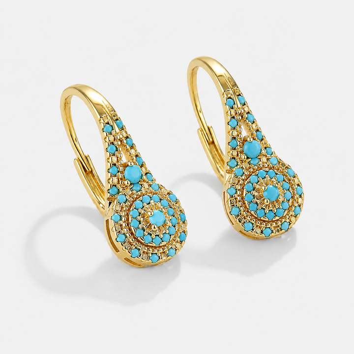 Boucles d’oreilles turquoise goutte avec détails dorés
