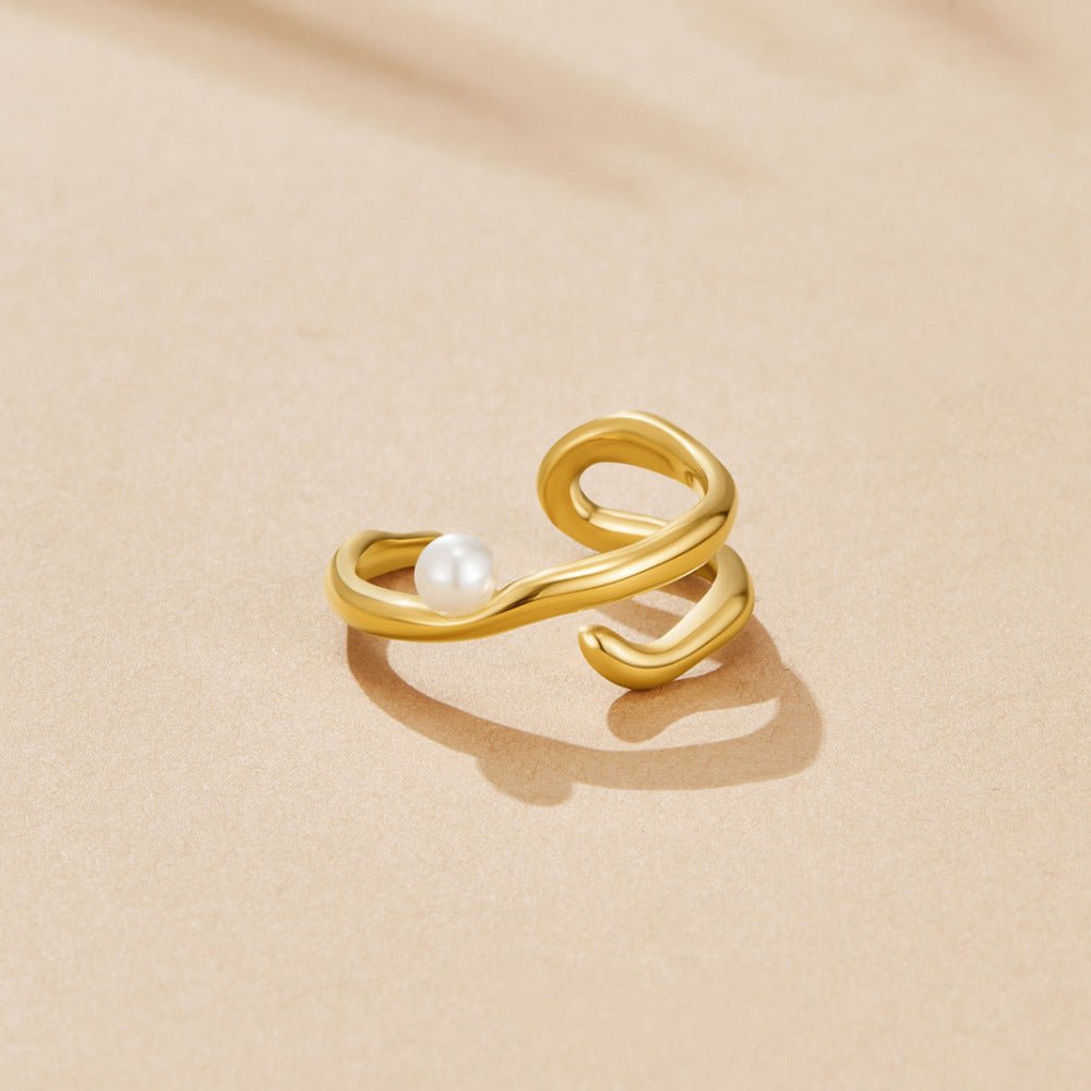 Bague géométrique dorée et perles