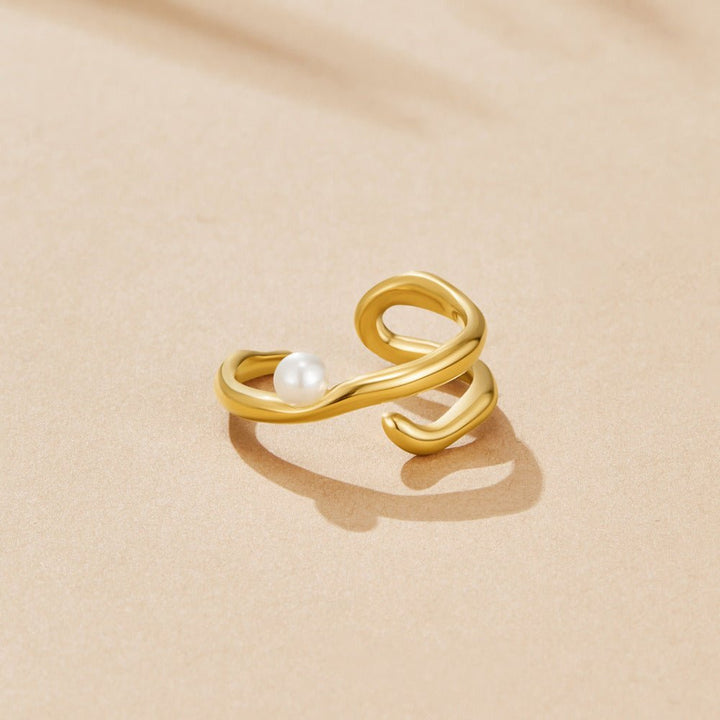 Bague géométrique dorée et perles