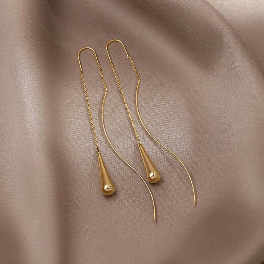 Boucles d’oreilles goutte dorées à pampille