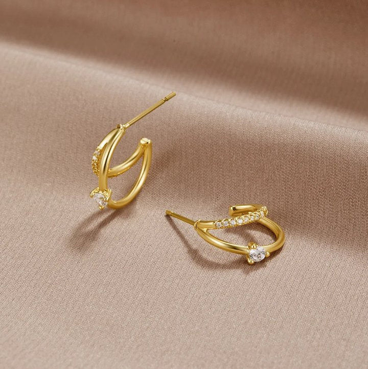 Boucles d’oreilles dorées multirangs en cristal