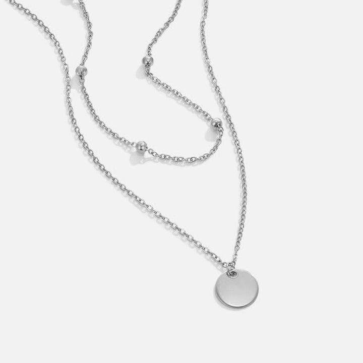 Collier argenté à médaillons
