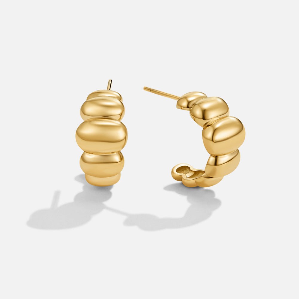 Boucles d’oreilles dorées bombées Rene