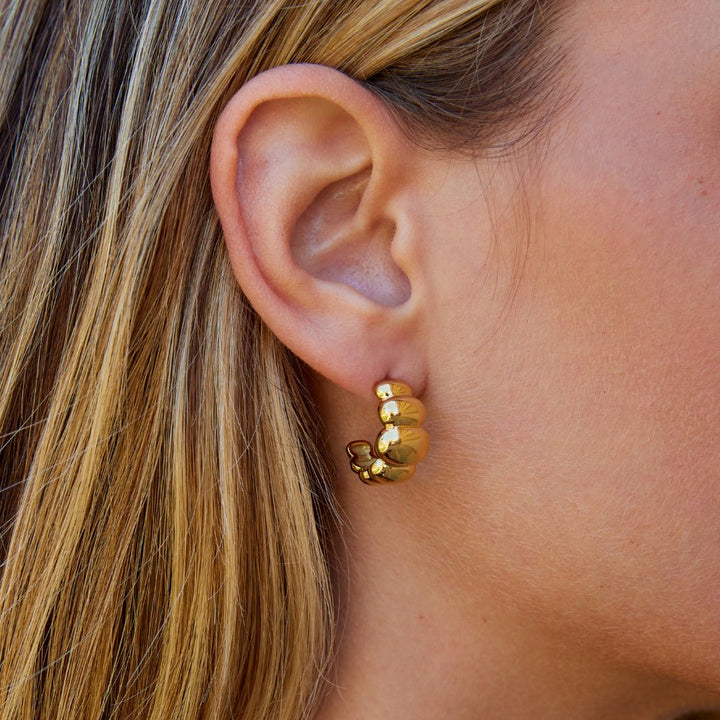 Boucles d’oreilles dorées bombées Rene