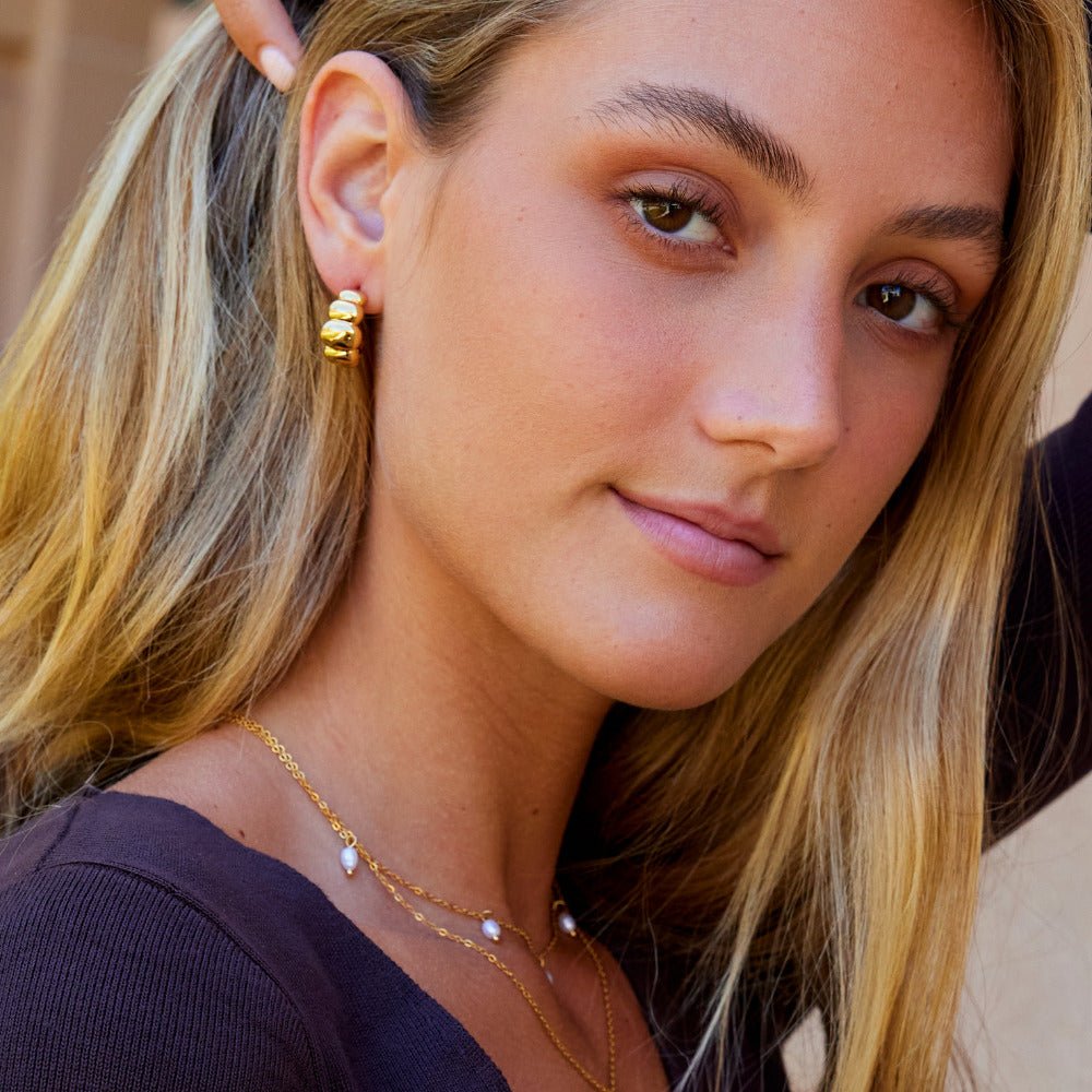 Boucles d’oreilles dorées bombées Rene