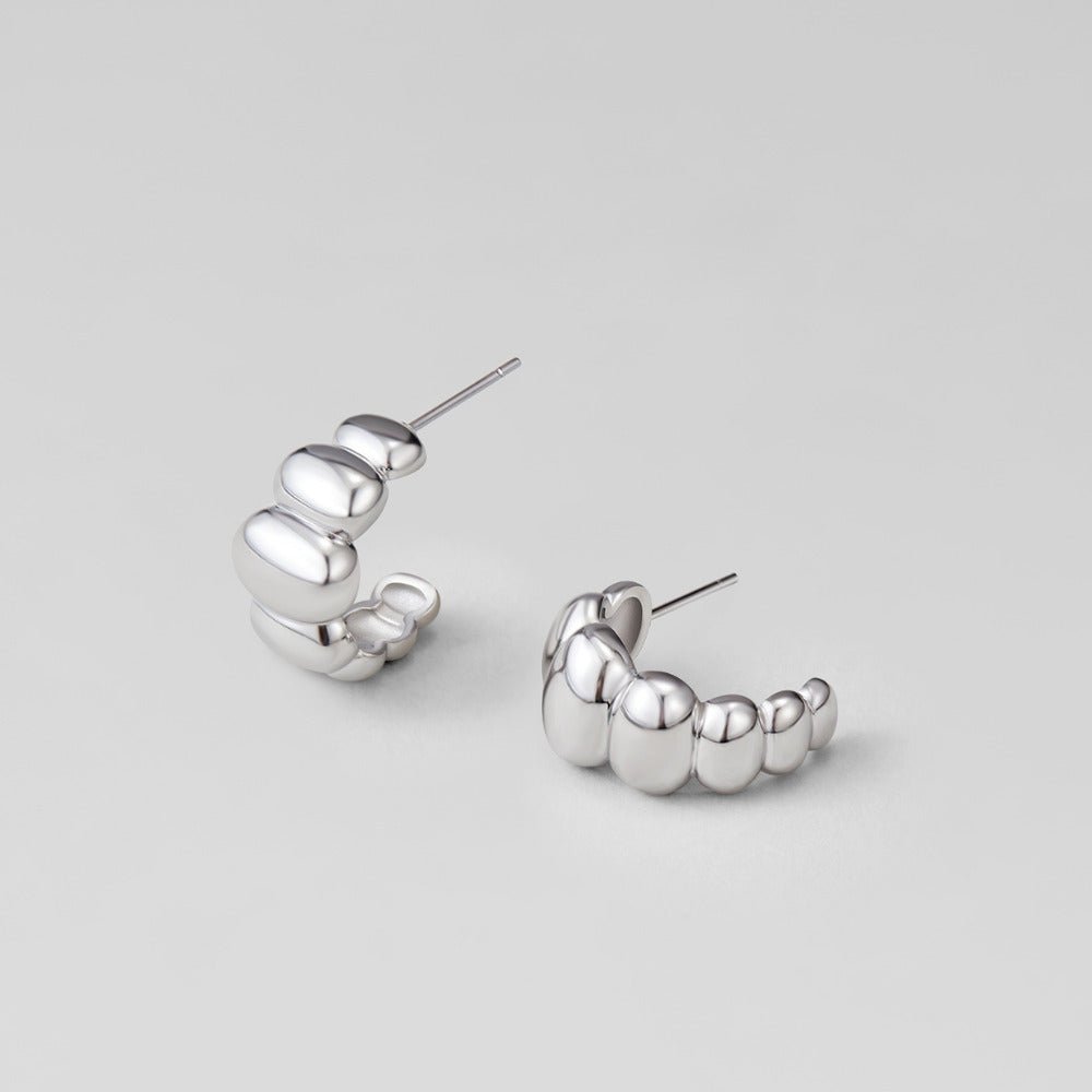 Boucles d’oreilles argentées bombées Rene