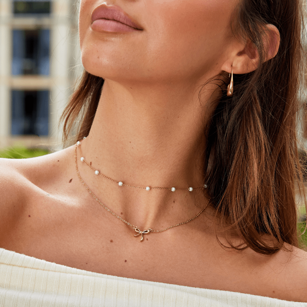 Collier avec pendentif v tvare mašle