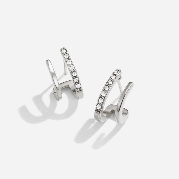 Boucles d’oreilles argentées en cristal serti griffes