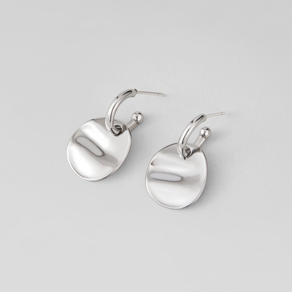 Boucles d’oreilles disque argentées