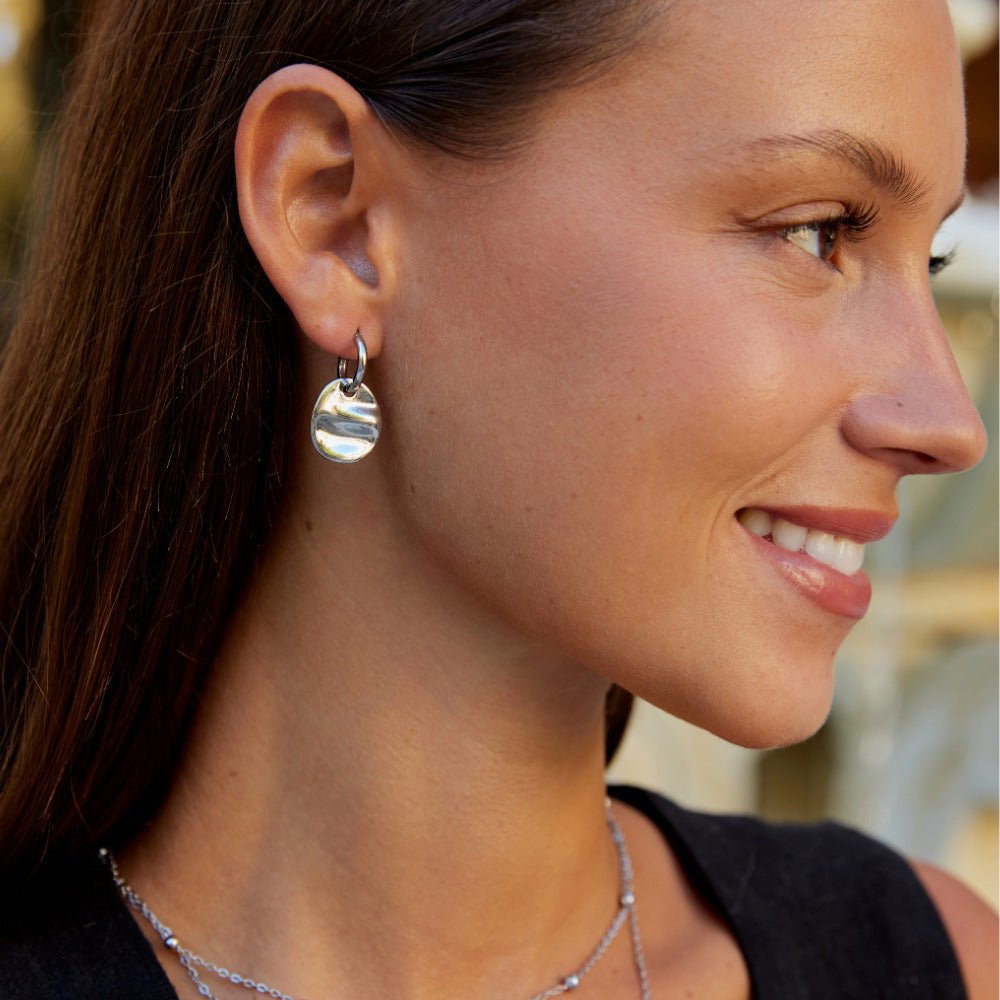 Boucles d’oreilles disque argentées